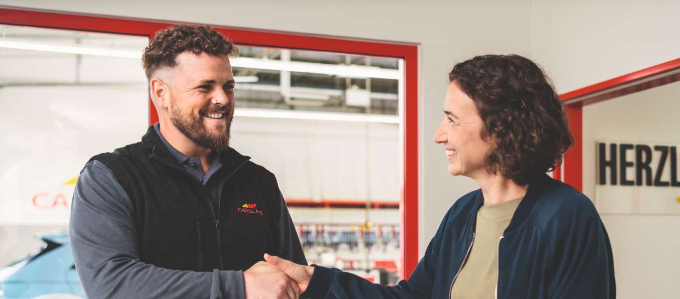 Technician shaking hands with customer