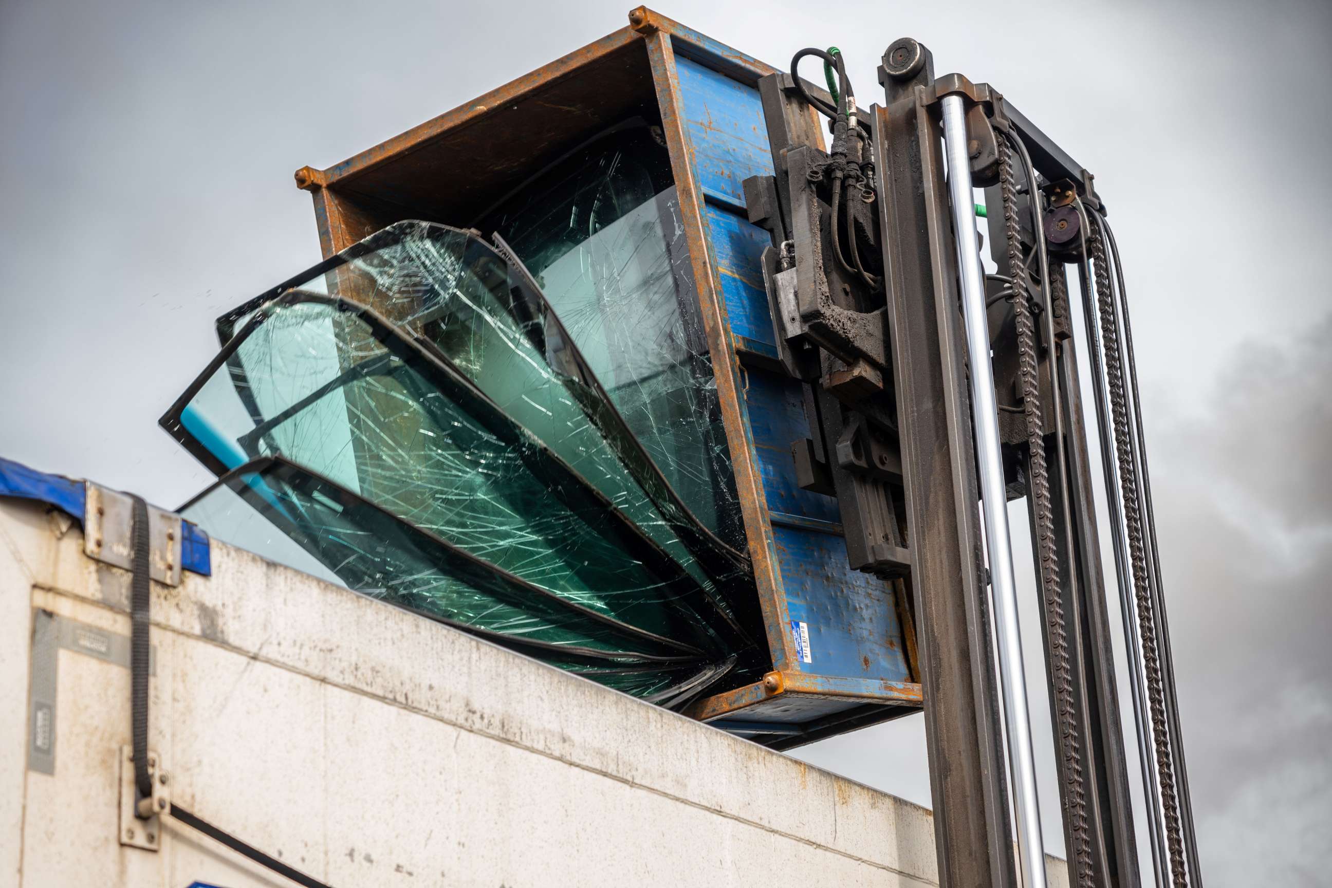 Broken glass being recycled